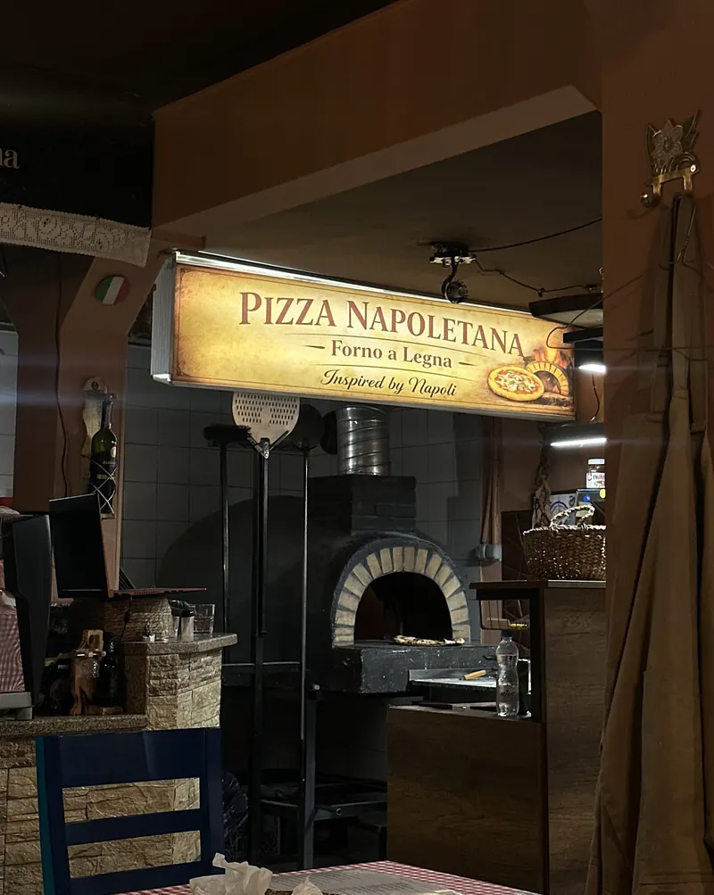 The Pizza Napoletana – Forno a Legna sign above the wood-fired oven