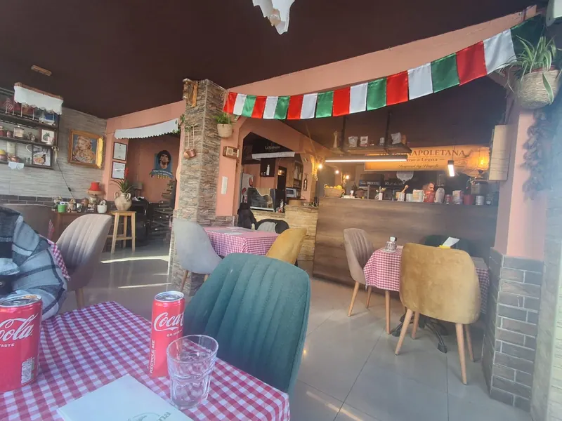 The dining room with Italian flag bunting and red-checked tables